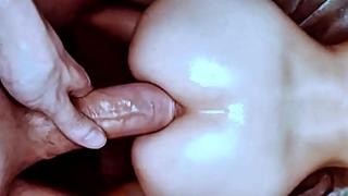 A man fucks a woman in the ass doggy style