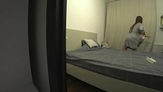 The man pushed the maid onto the bed and fucked her.