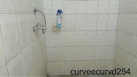 A man spies on a black woman in the shower