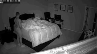 A muscular guy spanks someone else's wife while her husband sleeps nearby.