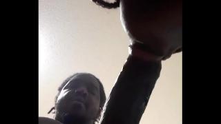 A black man gave a black woman a blowjob.