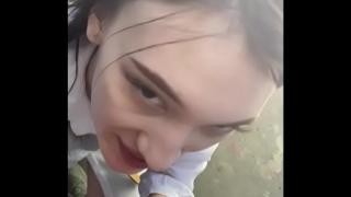 A student gives a blowjob on the street