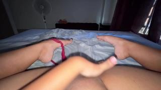 The girl took off her panties while lying on the bed and began to masturbate.