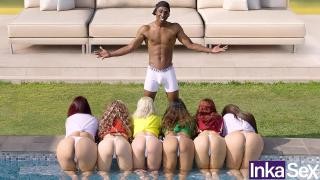 Six girls caress a black man with an erect penis