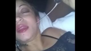 Men fuck a brunette in transparent clothing