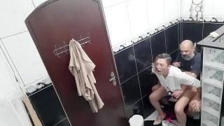 Brunette fucks an old man in the toilet